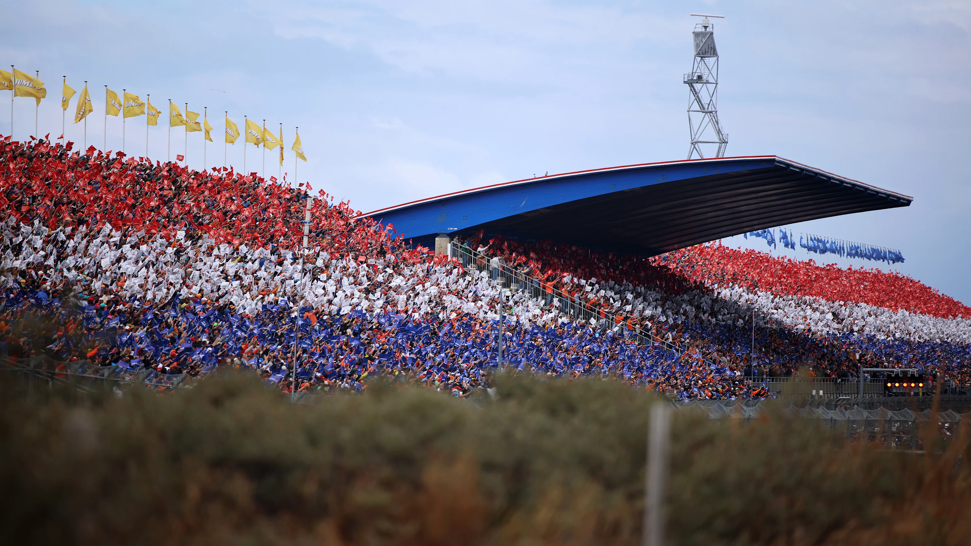 ZANDVOORT, NETHERLANDS - AUGUST 23: Fans form the Dutch colours in a grandstand prior to the F1
