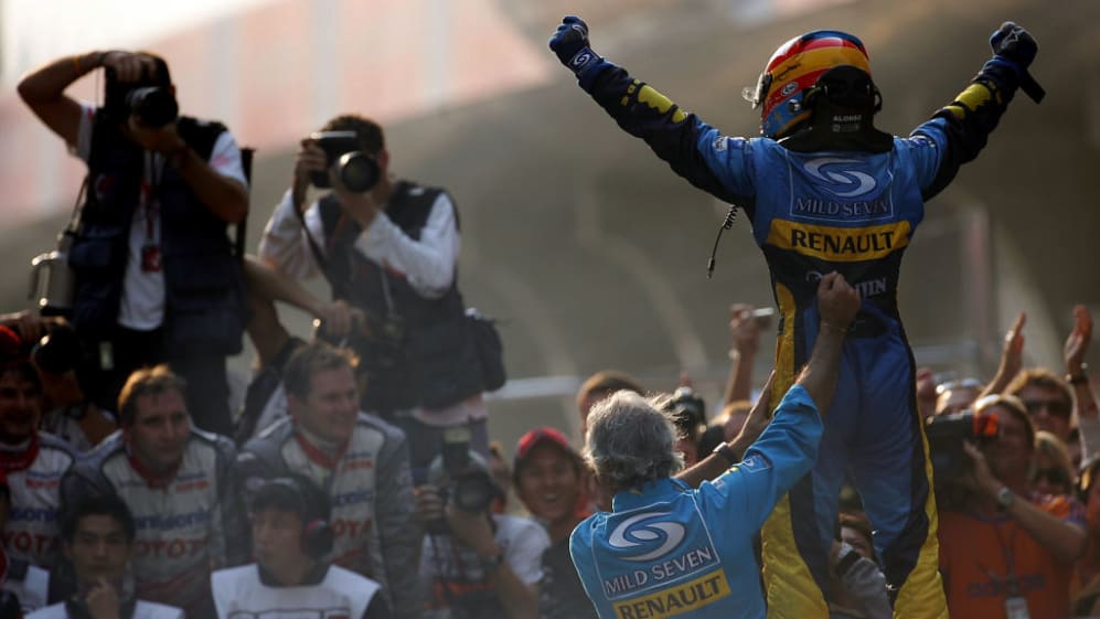 SHANGHAI, CHINA - OCTOBER 16: Fernando Alonso of Spain and Renault celebrates with the team
