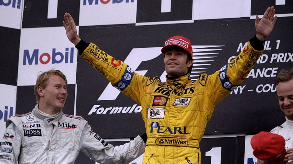 27 Jun 1999: Heinz-Harald Frentzen of the Jordan team is congratulated by Mika Hakkinen of McLaren