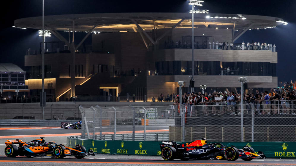 Red Bull Racing's Dutch driver Max Verstappen (R) and McLaren's Australian driver Oscar Piastri