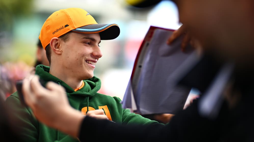 MELBOURNE, AUSTRALIA - MARCH 30: Oscar Piastri of Australia and McLaren greets fans on the