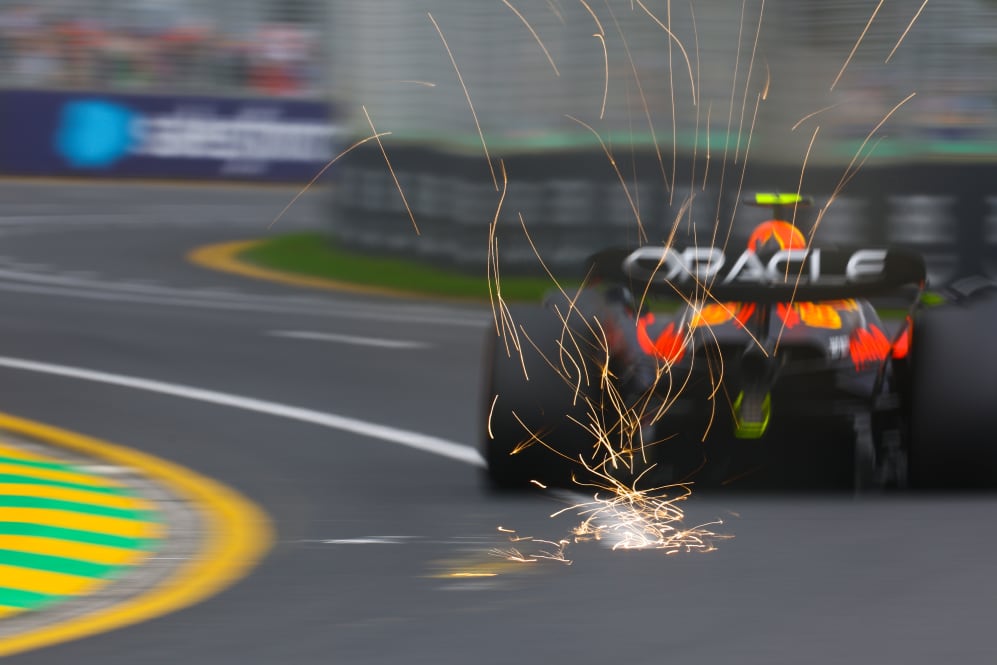 MELBOURNE, AUSTRALIA - APRIL 01: Sparks fly behind Sergio Perez of Mexico driving the (11) Oracle