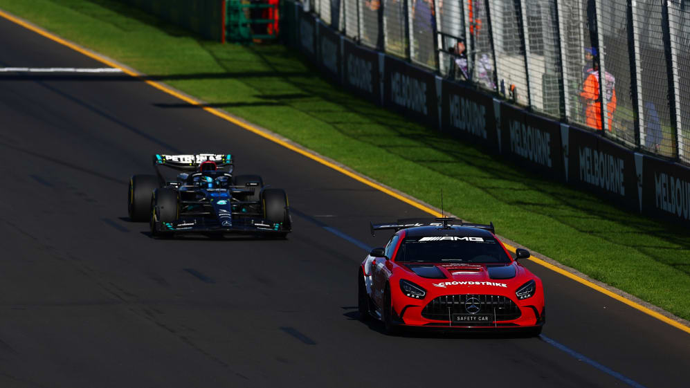 MELBOURNE, AUSTRALIA - APRIL 02: The FIA Safety Car leads George Russell of Great Britain driving