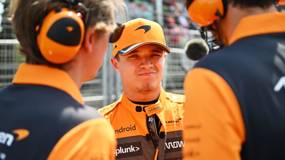 BAKU, AZERBAIJAN - APRIL 30: Lando Norris of Great Britain and McLaren talks with his team on the