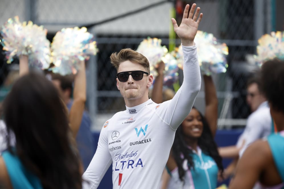 MIAMI, FLORIDA - MAY 07: Logan Sargeant of United States and Williams waves to the crowd from the