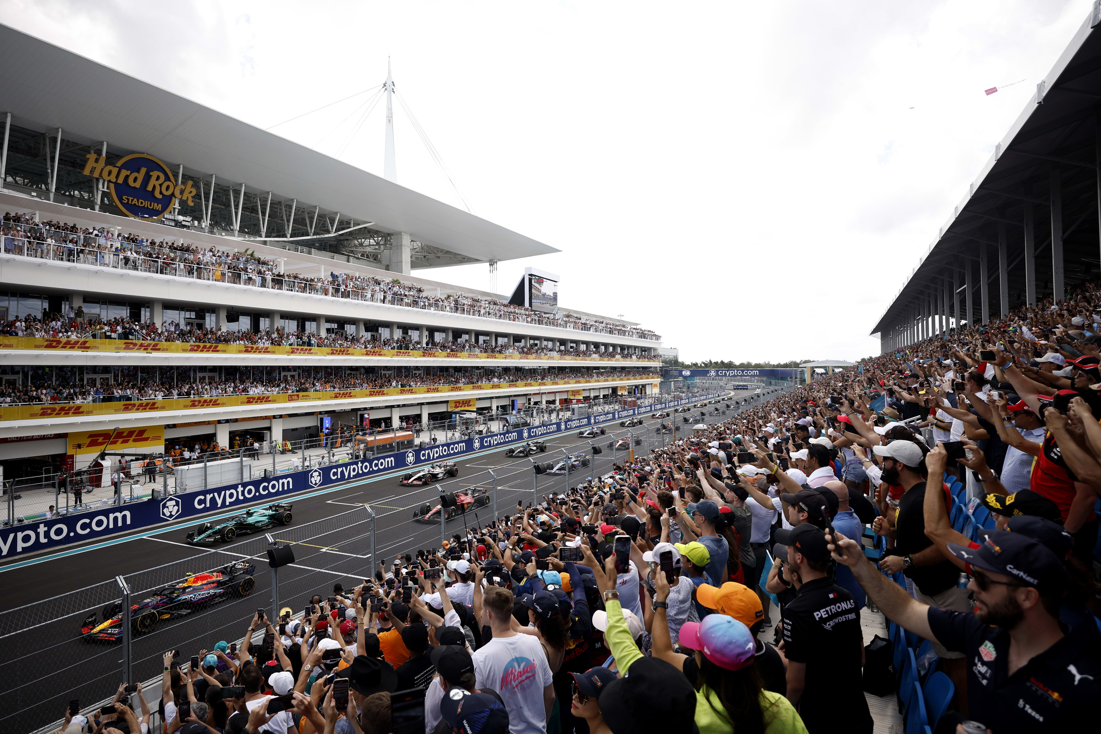 F1 fans ask 'is he single' as Lewis Hamilton rocks up at Brazilian