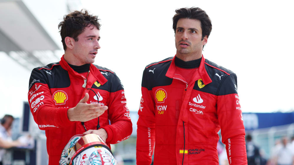 MIAMI, FLORIDA - MAY 07: Charles Leclerc of Monaco and Ferrari talks with Carlos Sainz of Spain and
