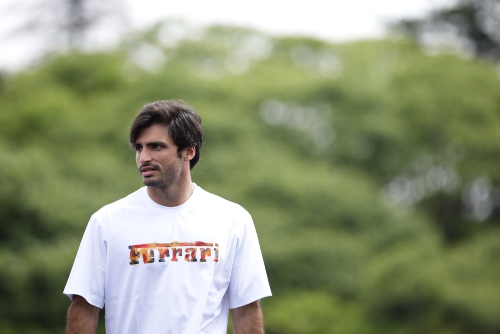 MONTREAL, QUEBEC - JUNE 15: Carlos Sainz of Spain and Ferrari walks in the Paddock during previews