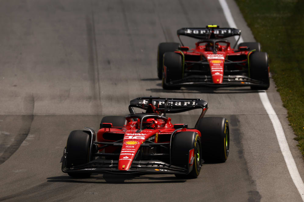 MONTREAL, QUEBEC - JUNE 18: Charles Leclerc of Monaco driving the (16) Ferrari SF-23 leads Carlos