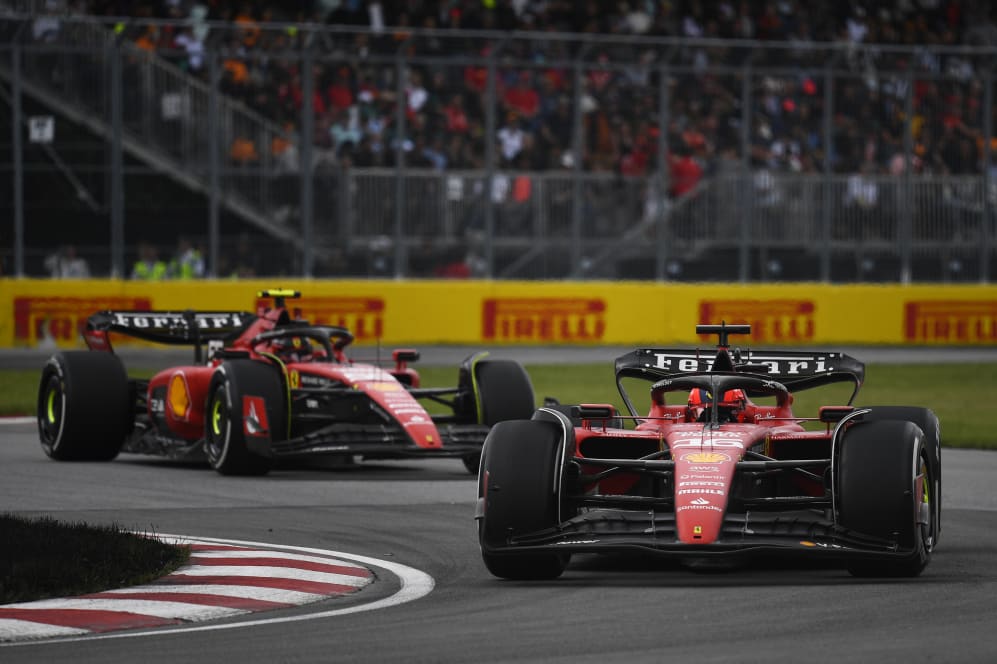 MONTREAL, QUEBEC - JUNE 18: Charles Leclerc of Monaco driving the (16) Ferrari SF-23 leads Carlos