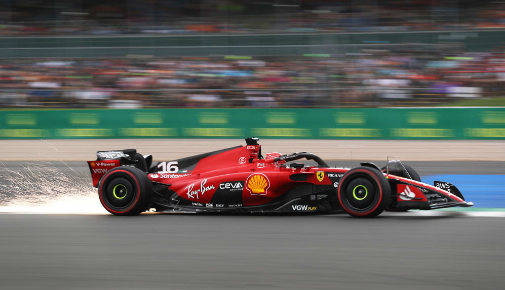 NORTHAMPTON, ENGLAND - JULY 08: Sparks fly behind Charles Leclerc of Monaco driving the (16)