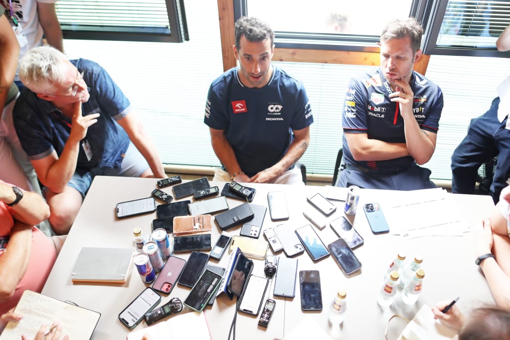 BUDAPEST, HUNGARY - JULY 20: Daniel Ricciardo of Australia and Scuderia AlphaTauri talks to the