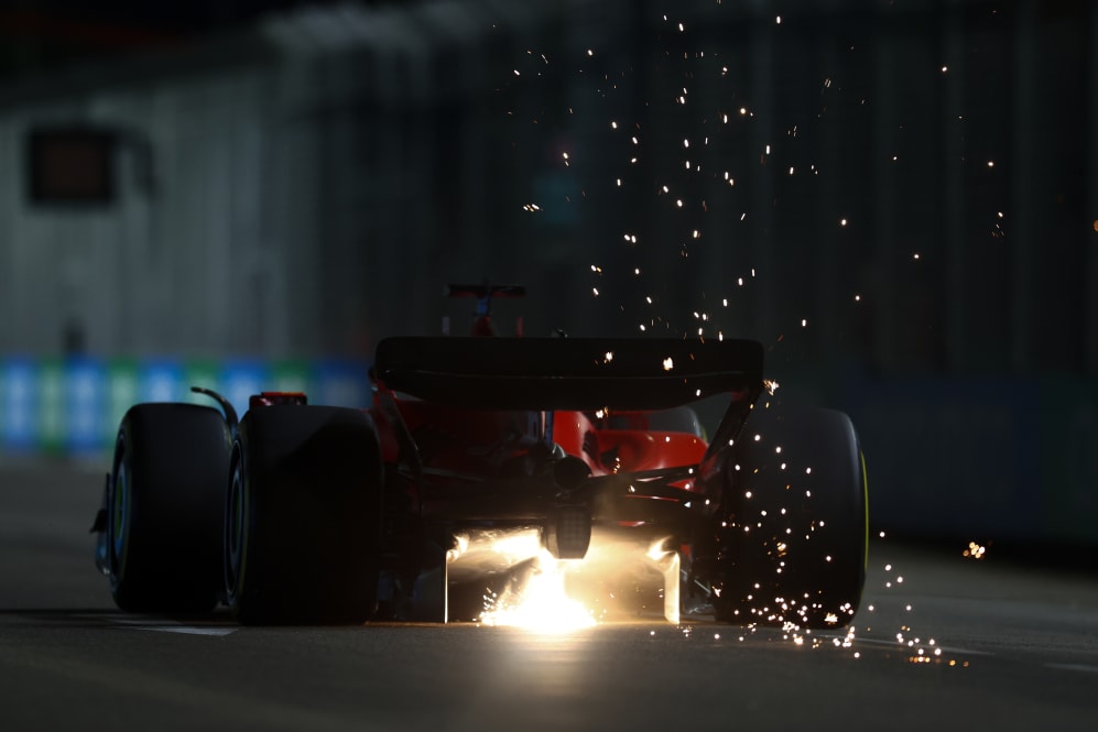 SINGAPORE, SINGAPORE - SEPTEMBER 15: Sparks fly behind Charles Leclerc of Monaco driving the (16)