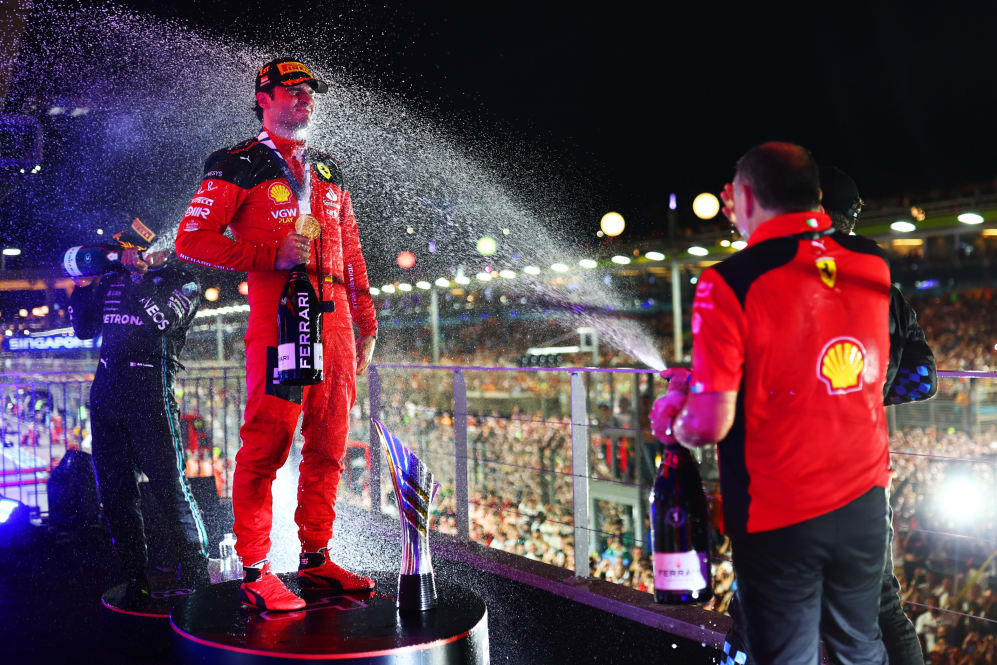 SINGAPORE, SINGAPORE - SEPTEMBER 17: Race winner Carlos Sainz of Spain and Ferrari celebrates with