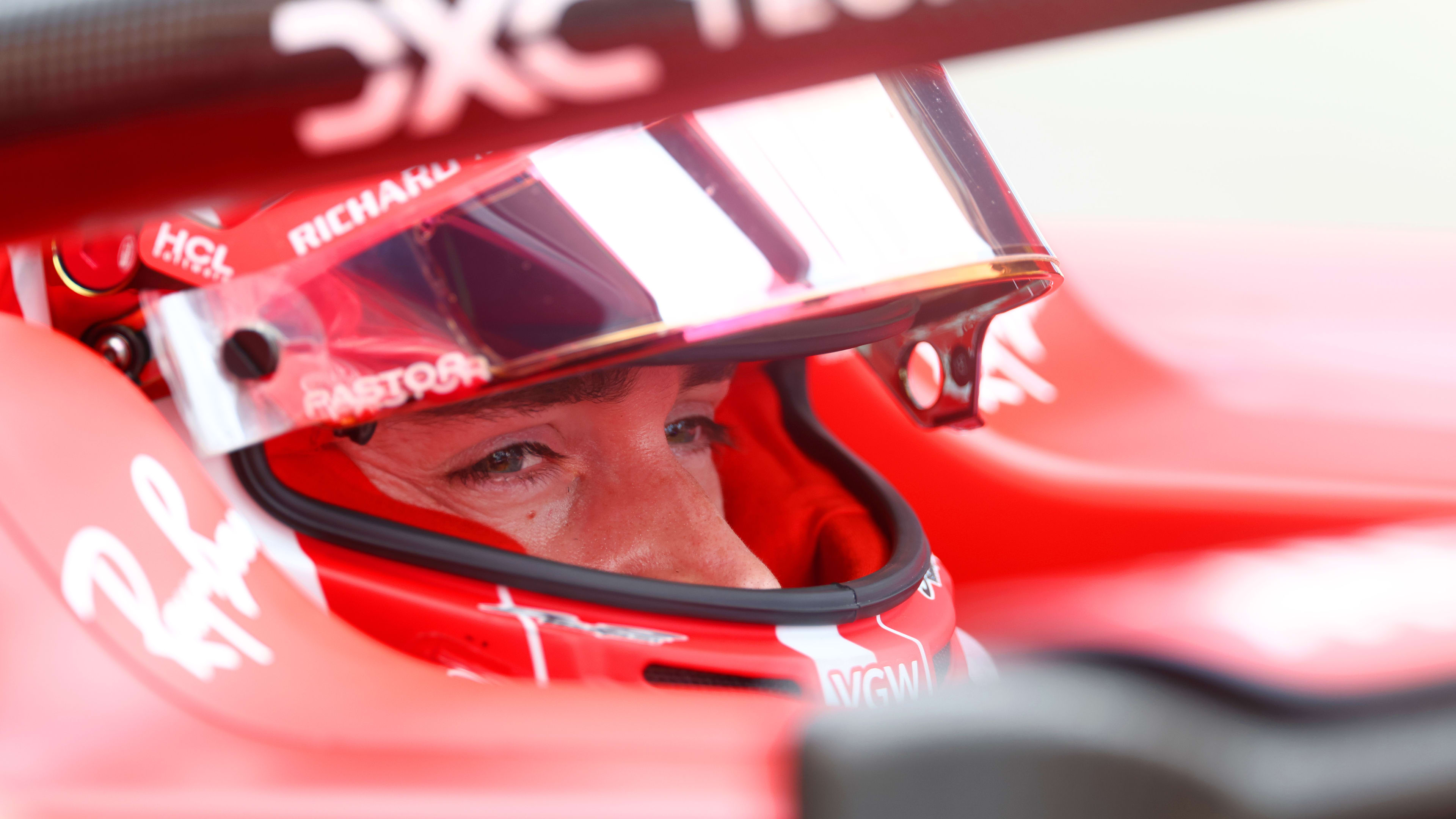 SUZUKA, JAPAN - SEPTEMBER 22: Charles Leclerc of Monaco and Ferrari prepares to drive in the garage