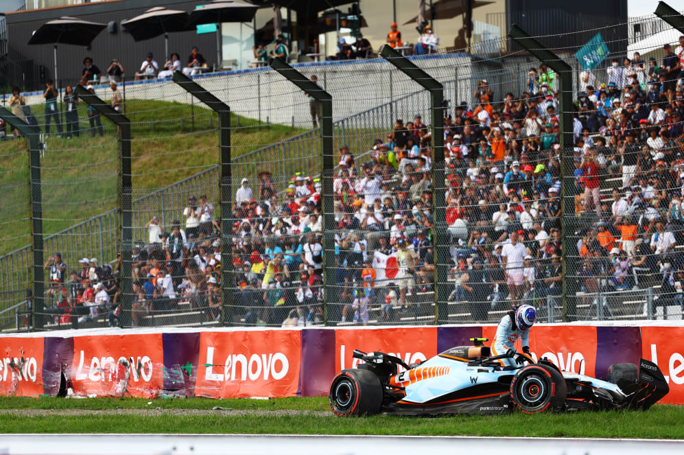 SUZUKA, JAPAN - SEPTEMBER 23: Logan Sargeant of United States and Williams climbs from his car