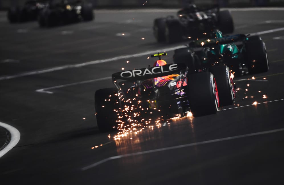 LAS VEGAS, NEVADA - NOVEMBER 18: Sparks fly behind Sergio Perez of Mexico driving the (11) Oracle